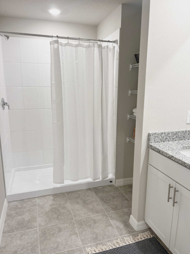 Master bathroom with walk-in shower and closet