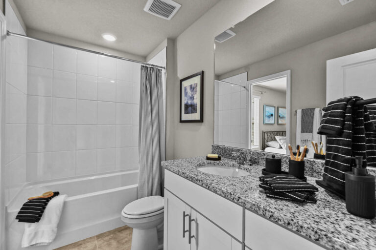 Bathroom with sink and combination bathtub and shower