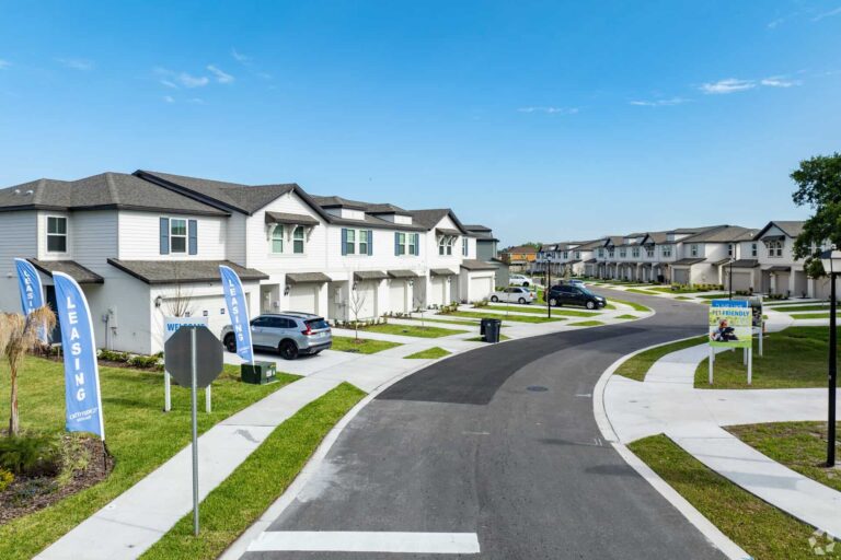 Row of townhomes along a neighborhood road at L’Attitude 27 Riverview